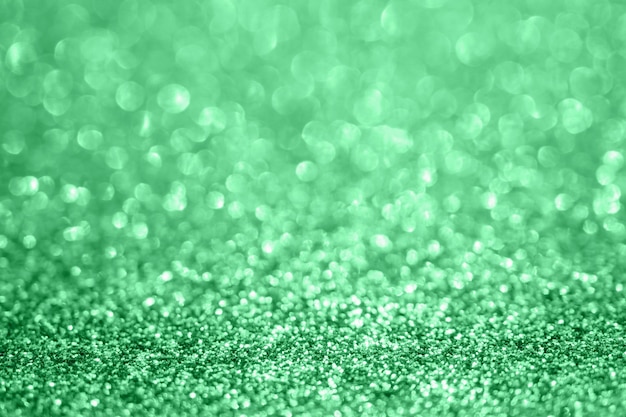 Abstract blur green glitter sparkle defocused bokeh light background