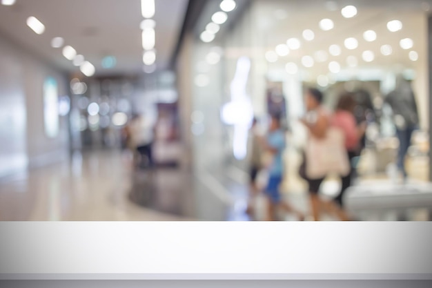 Foto immagine astratta di sfocatura di persone che camminano al centro commerciale o alla sala espositiva con bokeh per l'utilizzo in background