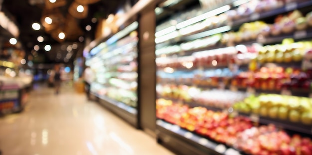 Abstract blur organic fresh fruits and vegetable on grocery shelves in supermarket store defocused bokeh light background