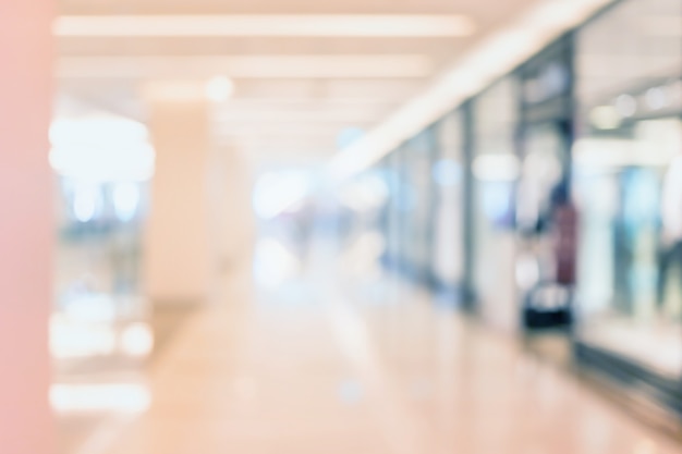 Photo abstract blur shopping mall and department store interior with people walking