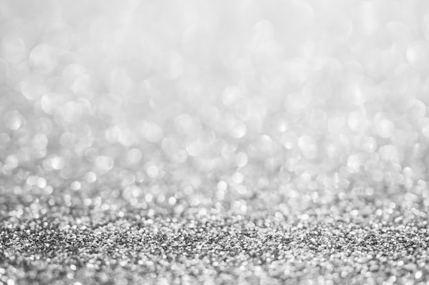 Abstract blur silver glitter sparkle defocused bokeh light background