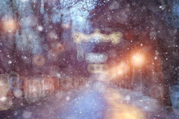 abstract blurred background, landscape christmas snow city street falling snowflakes, holidays winter