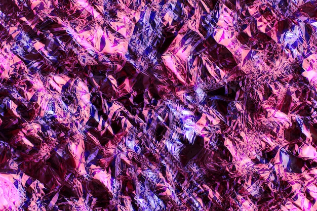Абстрактный размытый фон. рельефная рельефная поверхность, металлическая фольга разных цветов. размытие