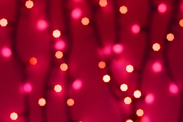 Abstract blurred bokeh lights on red