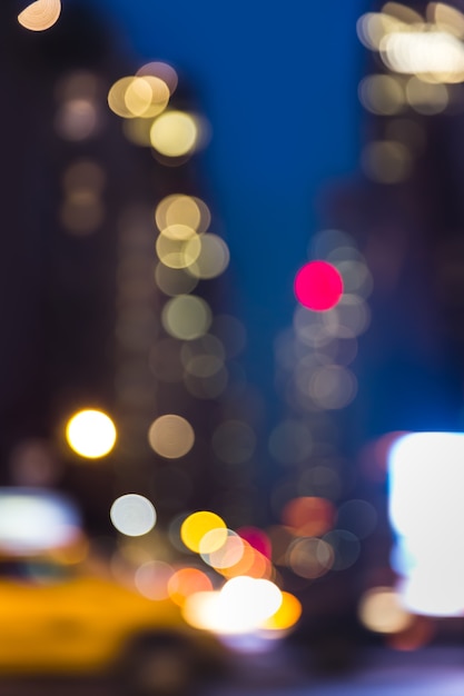 Abstract blurred city background. Large city street lights at night. Lights and shadows of New York City