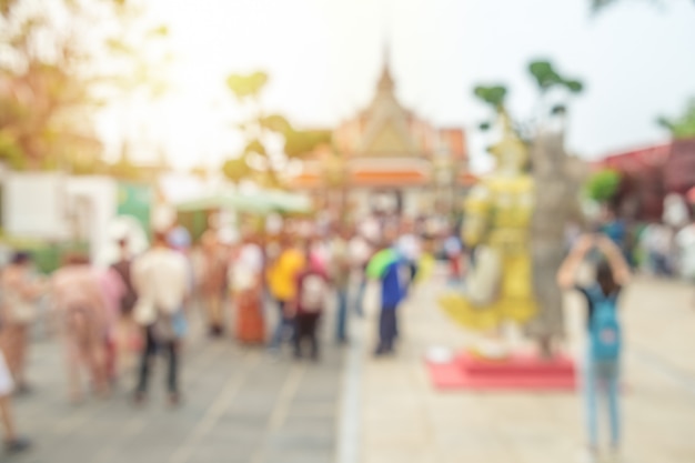 Abstract blurred image, crowd of tourists at the Wat Arun temple. Bangkok, Thailand.