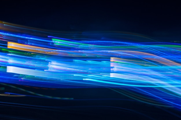 Abstract blurred light lines on black background. Light trails 