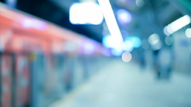 An abstract blurred subway station background, city life and public transportation concept