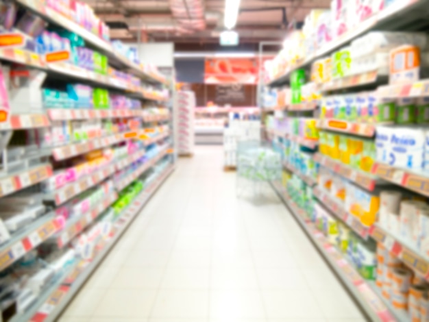 Abstract blurred supermarket aisle with colorful shelves