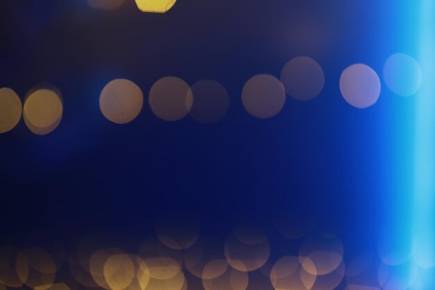 Abstract bokeh background Golden bokeh circles on a dark blue background Layer overlay