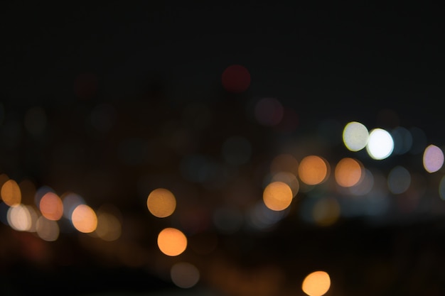 Abstract bokeh night garden in city background.