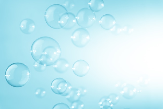 Abstract bright blue soap bubbles background