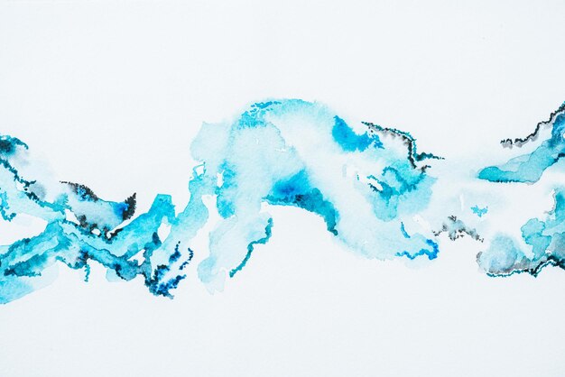 Abstract bright blue watercolor blots on paper