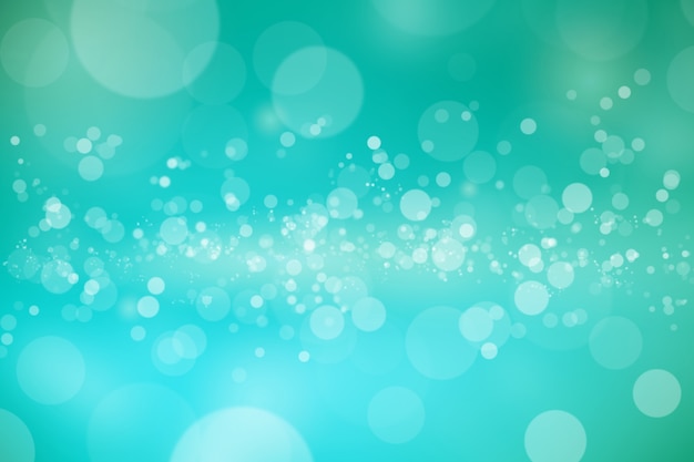 Abstract bright bokeh on emerald green blurred background