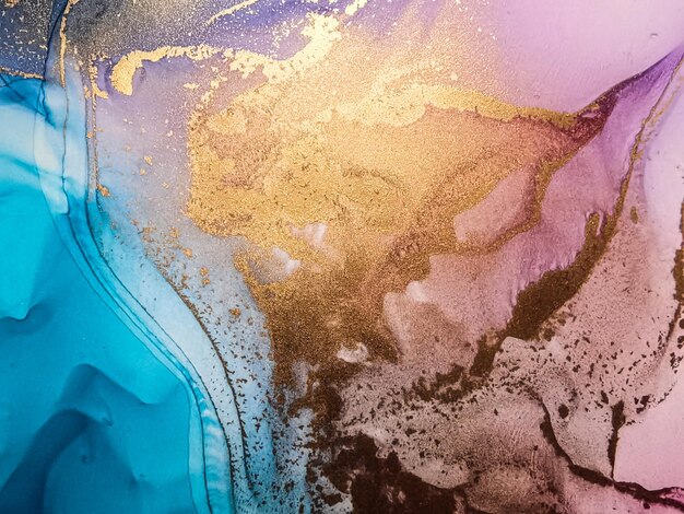 Abstract bright shiny color fluid background hand drawn alcohol painting with golden streaks liquid ink technique texture for backdrop design