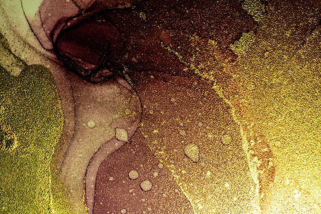 高解像度の背景デザインのための金色の縞の液体インク技術テクスチャと抽象的な明るい光沢のある色の流体背景手描きアルコール絵画