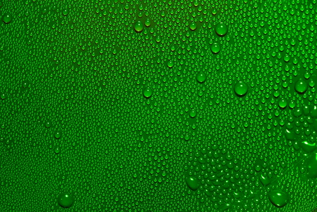 Abstract bright water drops texture on green background 