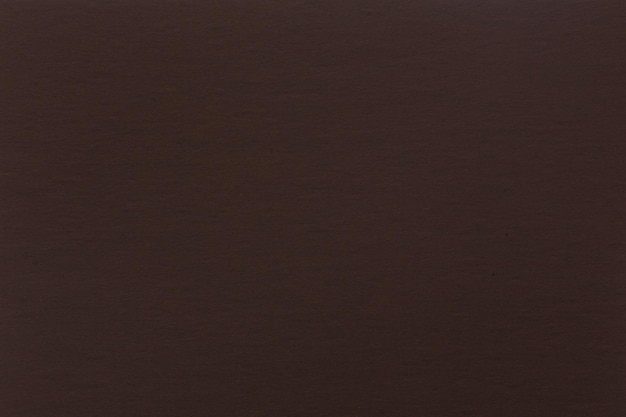Abstract brown paper background Texture of dark brown paper