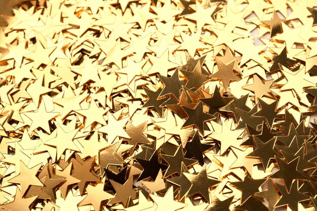 Photo abstract christmas background with gold stars confetti