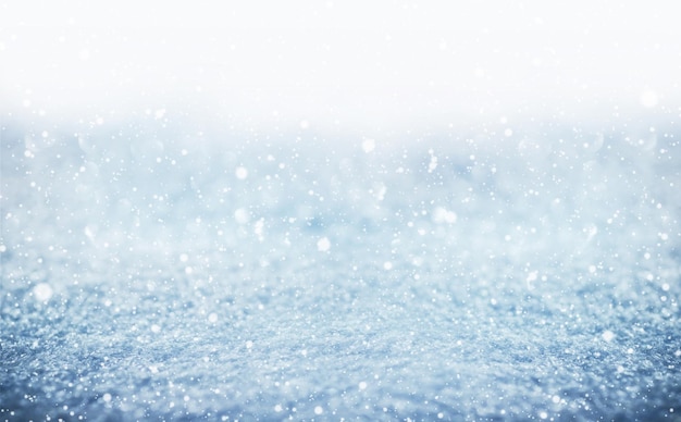 Abstract Christmas blurry background winter white background with falling snow