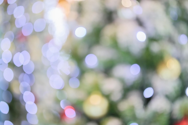 Abstract christmas holiday with festive gold bokeh light on tree blurred background