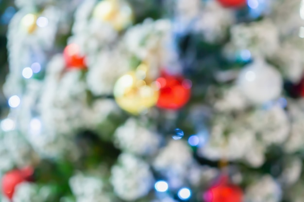 Abstract christmas holiday with festive gold bokeh light on tree blurred