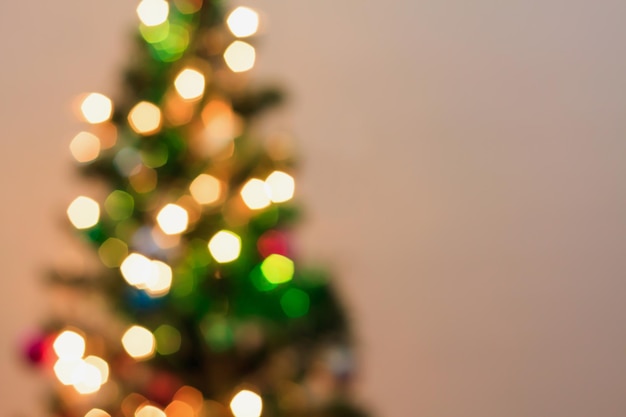 Abstract Christmas tree with decorations bokeh light blur background