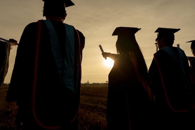 Abstract Close up Rear view group of the university graduates at Silhouette sunset