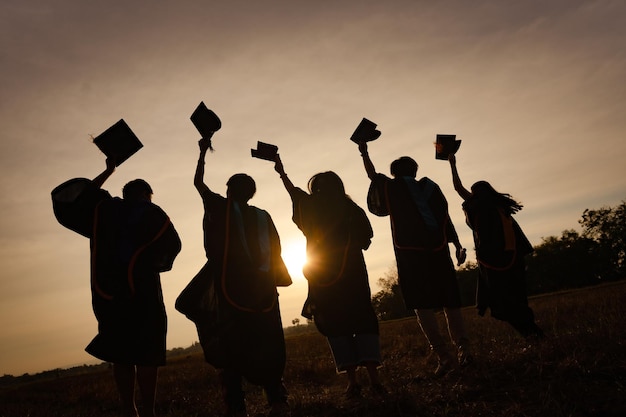 Abstract Close up Rear view group of the university graduates at Silhouette sunset