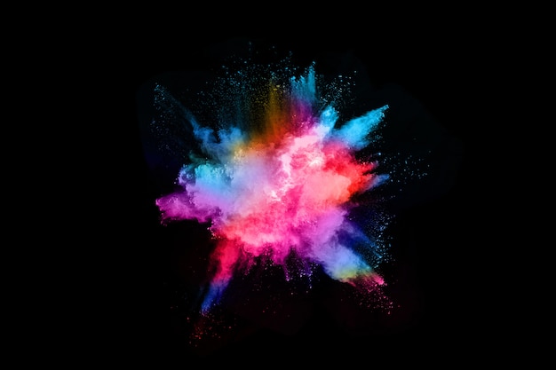 Abstract colored dust explosion on  black background.abstract powder splatted background.