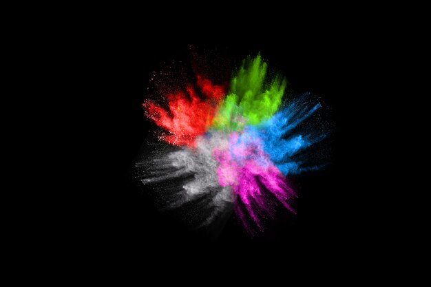 Abstract colored dust explosion on  black background.abstract powder splatted background. 