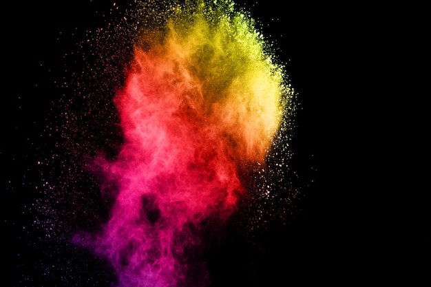 abstract colored dust explosion on a black background.