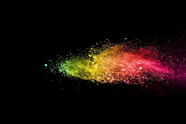 abstract colored dust explosion on a black background.