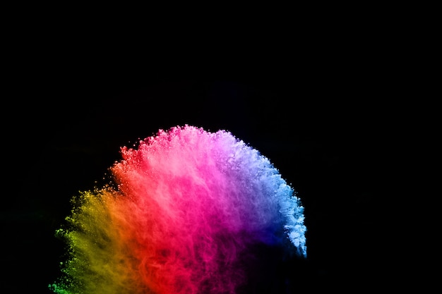 Abstract colored dust explosion on  black background.