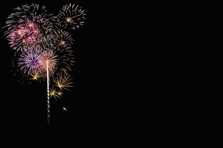 Photo abstract colored firework background with free space for text