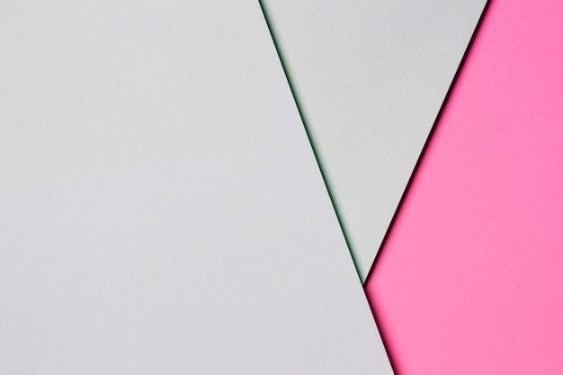 Фото Абстрактная стена текстуры цветной бумаги. минимальные геометрические формы и линии в светло-зеленых и пастельно-розовых тонах