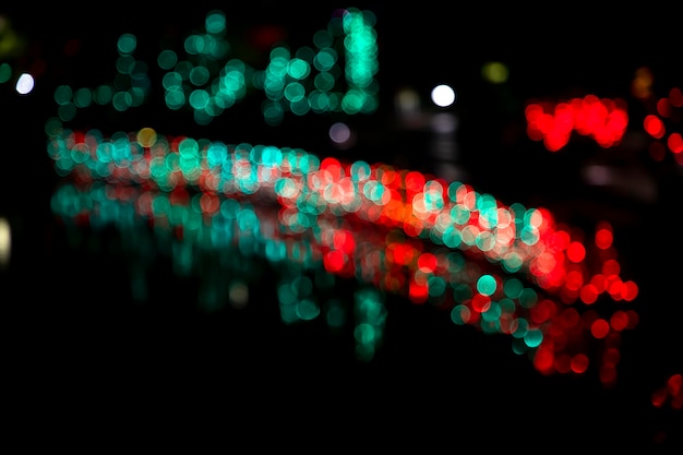 Abstract colorful bokeh light effects on the night black background texture