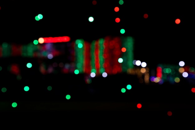 Abstract colorful bokeh light effects on the night black background texture