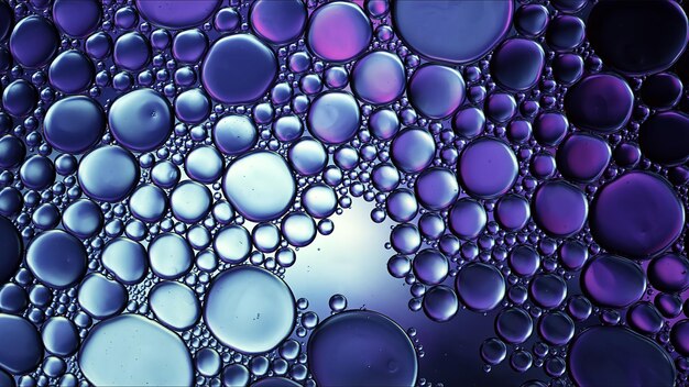 Abstract Colorful Food Oil Drops Bubbles and spheres Flowing on Water Surface Macro Photography