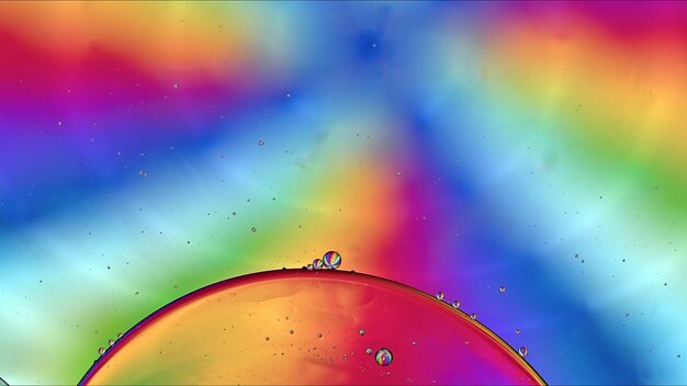 abstract colorful food oil drops bubbles and spheres flowing on water surface macro photography
