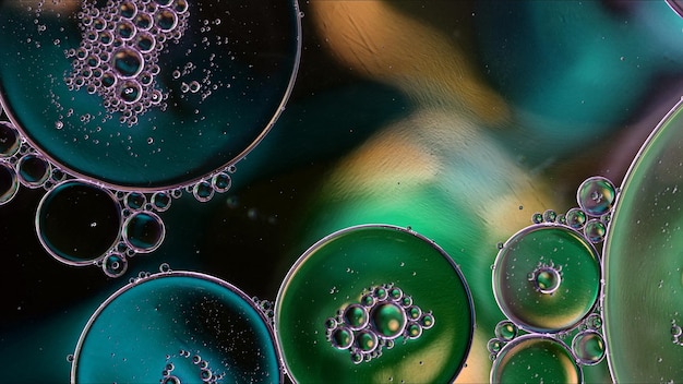 Photo abstract colorful food oil drops bubbles and spheres flowing on water surface macro photography