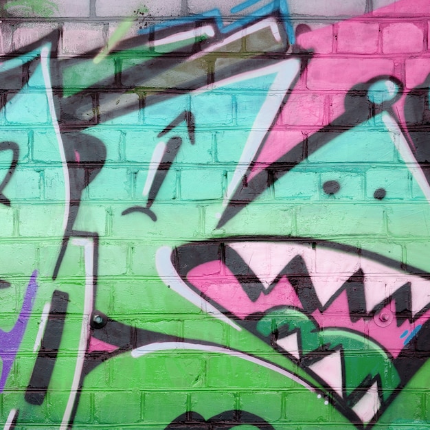 Абстрактный красочный фрагмент граффити на старой кирпичной стене в зеленых тонах