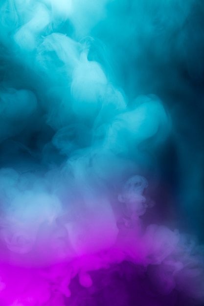 Abstract colorful, multicolored smoke spreading, bright background for advertising or design, wallpaper for gadget. Neon lighted smoke texture, blowing clouds. Modern designed.