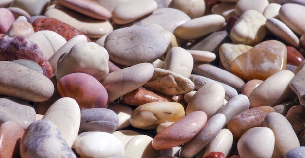 Abstract colorful pebbles stones. A unique pattern for design, background, wallpaper.