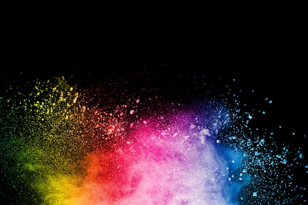 Abstract colorful powder explosion on black 