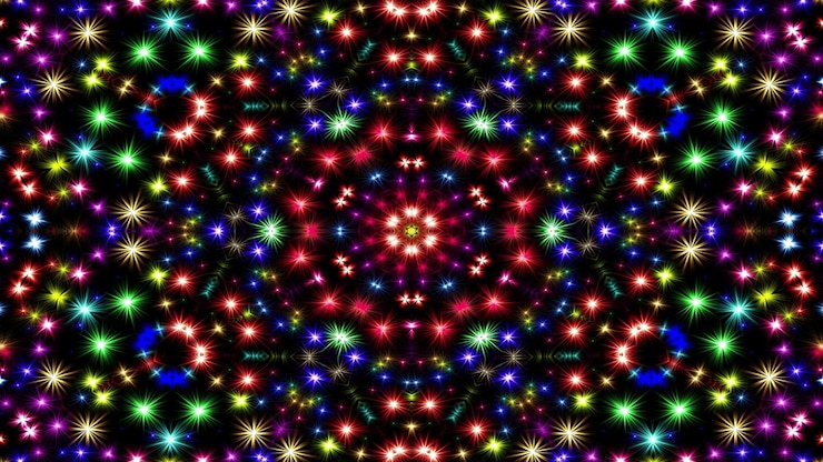 Photo abstract colorful shiny and hypnotic concept symmetric pattern ornamental decorative kaleidoscope movement geometric circle and star shapes