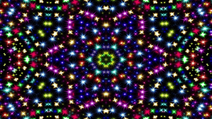Photo abstract colorful shiny and hypnotic concept symmetric pattern ornamental decorative kaleidoscope movement geometric circle and star shapes