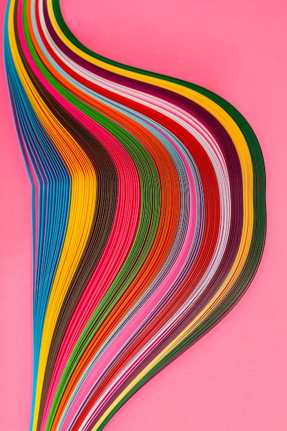 Abstract composition with a figure from colored paper on a colored background