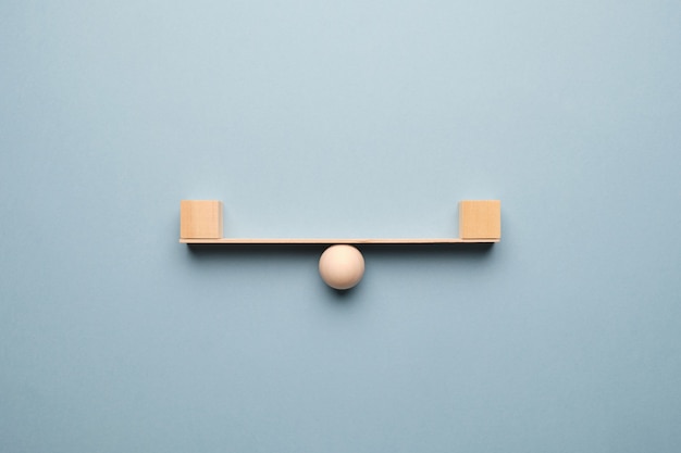 Abstract concept of balance with wooden walls.