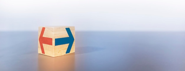 Abstract concept of business path decisionThe wooden box has a left or right alternative arrow icon